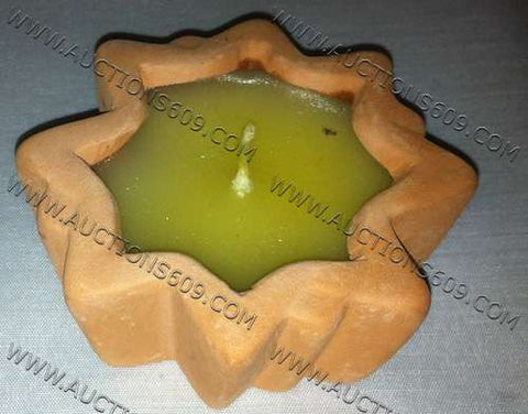 yellow candle with clay - vela amarilla con barro